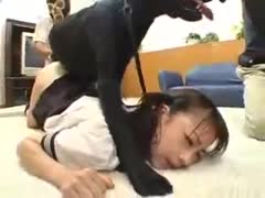 Face down, a frail Asian 18-year-old is mounted and screwed by a large dog.